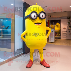 Yellow Cyclops mascot costume character dressed with a Capri Pants and Eyeglasses