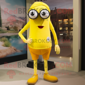Yellow Cyclops mascot costume character dressed with a Capri Pants and Eyeglasses