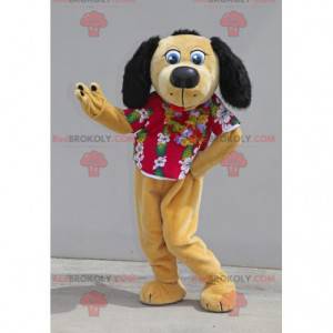Mascota de perro beige y negro con una camisa floral -