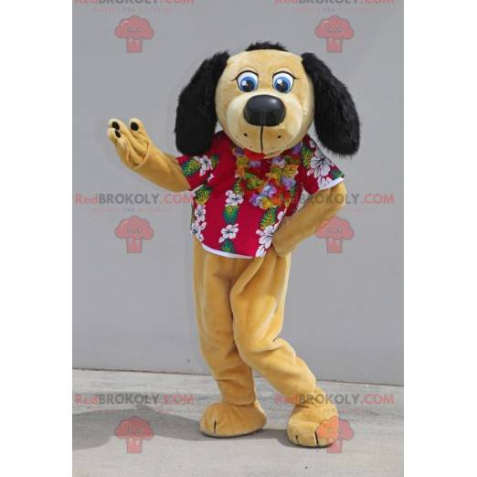 Beige und schwarzes Hundemaskottchen mit einem Blumenhemd -