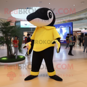 Lemon Yellow Killer Whale mascot costume character dressed with a Skinny Jeans and Belts