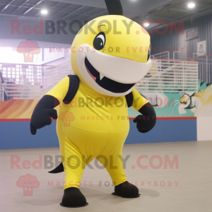 Lemon Yellow Killer Whale mascot costume character dressed with a Skinny Jeans and Belts