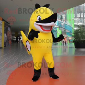 Lemon Yellow Killer Whale mascot costume character dressed with a Skinny Jeans and Belts
