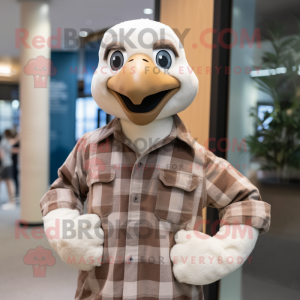 Beige Albatross mascot costume character dressed with a Flannel Shirt and Watches