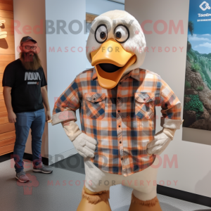 Beige Albatross mascot costume character dressed with a Flannel Shirt and Watches