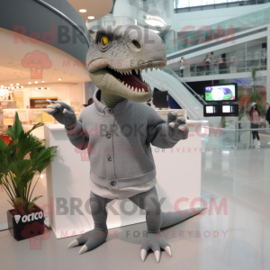 Gray Tyrannosaurus mascot costume character dressed with a Sweater and Brooches