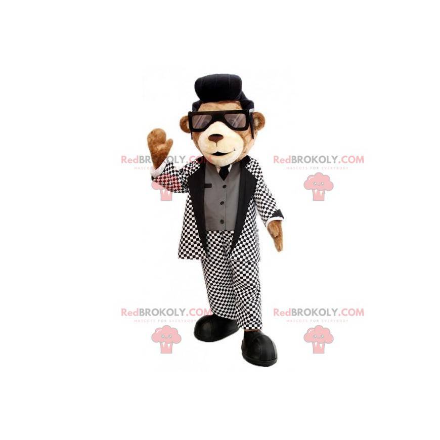 Mascotte de nounours marron avec un joli costume noir et blanc