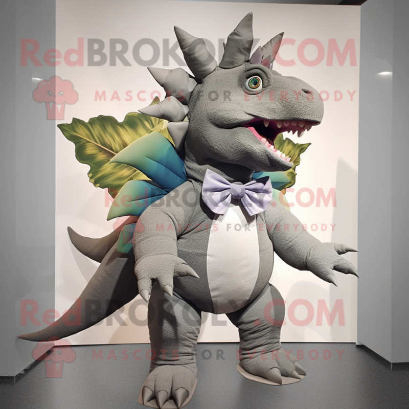 Gray Stegosaurus mascot costume character dressed with a Bermuda Shorts and Bow ties Gray Stegosaurus mascot costume character dressed with a Bermuda Shorts and Bow ties