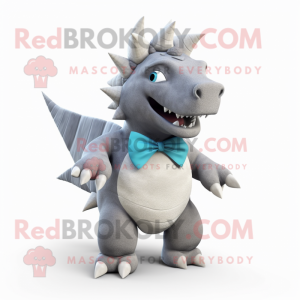 Gray Stegosaurus mascot costume character dressed with a Bermuda Shorts and Bow ties