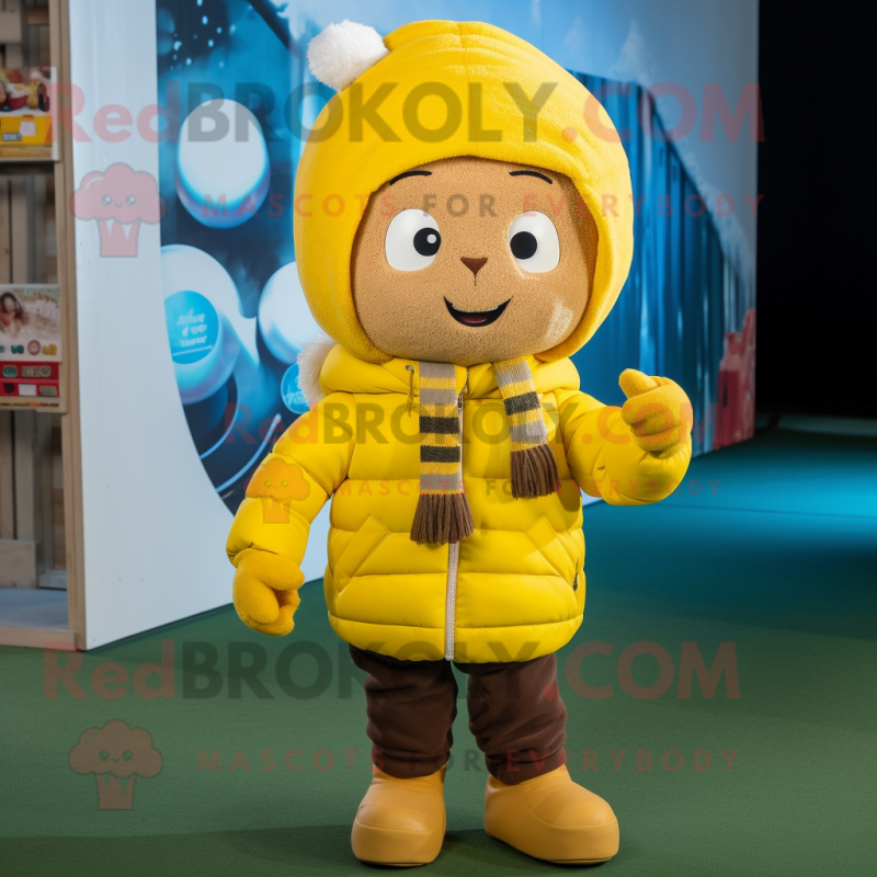 Yellow Rugby Ball mascot costume character dressed with a Parka and Beanies Yellow Rugby Ball mascot costume character dressed with a Parka and Beanies