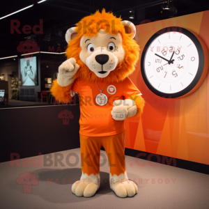 Orange Lion mascot costume character dressed with a Shift Dress and Smartwatches