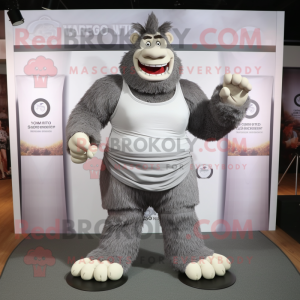 Gray Strongman mascot costume character dressed with a Pleated Skirt and Anklets