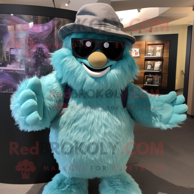 Teal Yeti mascot costume character dressed with a Leather Jacket and Hat pins Teal Yeti mascot costume character dressed with a Leather Jacket and Hat pins