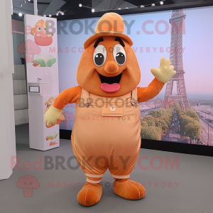 Peach Croissant mascot costume character dressed with a Dungarees and Lapel pins