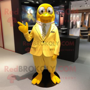 Yellow Penguin mascot costume character dressed with a Dress Pants and Cufflinks