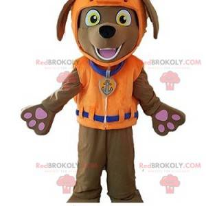Mascota perro marrón con chaleco salvavidas - Redbrokoly.com