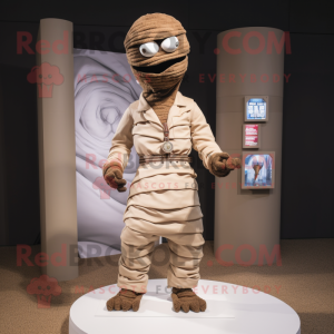 Brown Mummy mascot costume character dressed with a Poplin Shirt and Lapel pins