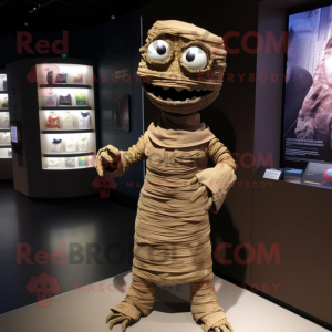 Brown Mummy mascot costume character dressed with a Poplin Shirt and Lapel pins