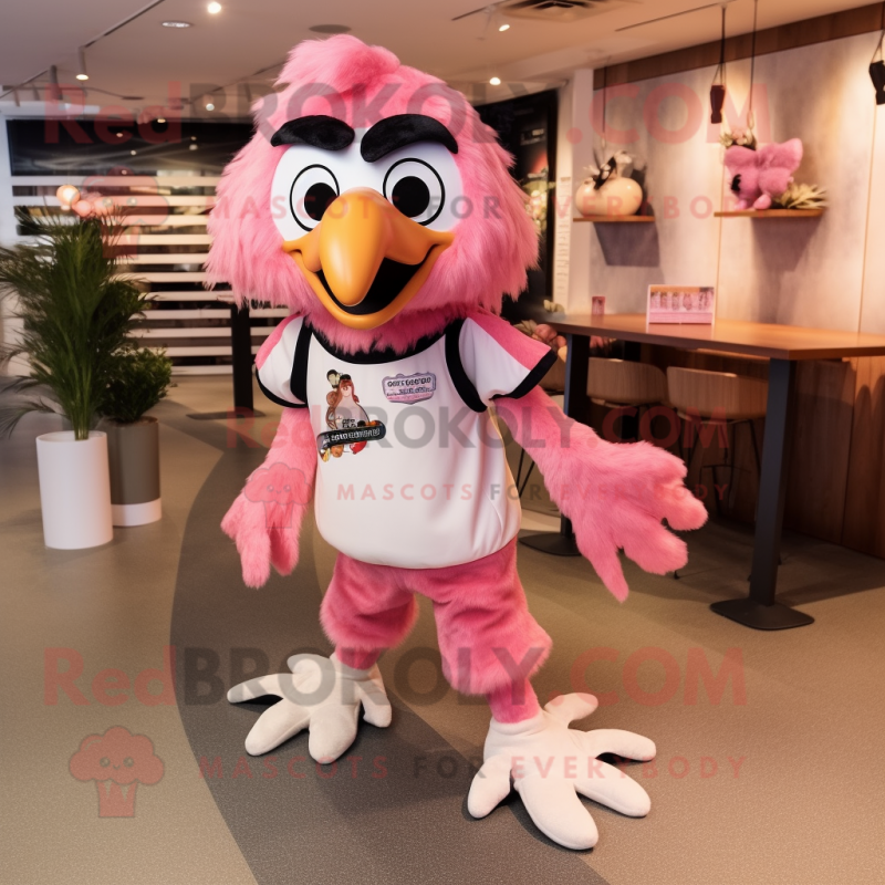 Pink Falcon mascot costume character dressed with a Dungarees and Shoe clips Pink Falcon mascot costume character dressed with a Dungarees and Shoe clips