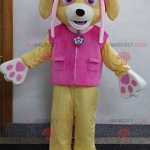 Beiges Hundemaskottchen mit einem rosa Outfit - Redbrokoly.com