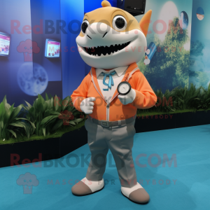 Peach Shark mascot costume character dressed with a Button-Up Shirt and Smartwatches