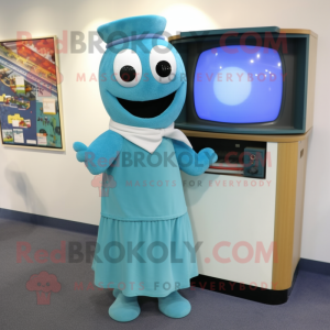 Turquoise Television mascot costume character dressed with a Oxford Shirt and Shawl pins