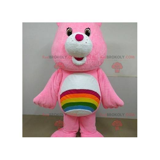 Mascotte rosa dell'orso di cura con un arcobaleno -