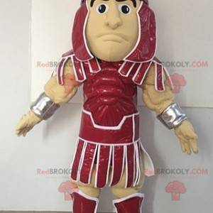 Gladiator Maskottchen in einem roten Outfit gekleidet -