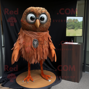Rust Owl mascot costume character dressed with a Rash Guard and Shawl pins