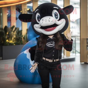 Black Killer Whale mascot costume character dressed with a Blouse and Berets