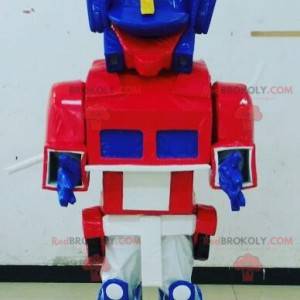 Blå, hvid og rød legetøjsmaskot Transformers måde -