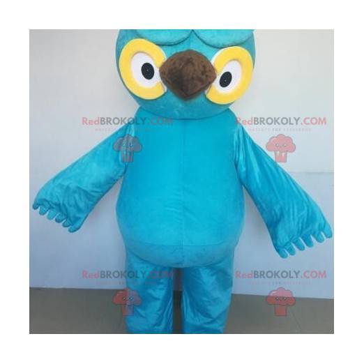 Giant blue and yellow owl mascot with big eyes - Redbrokoly.com