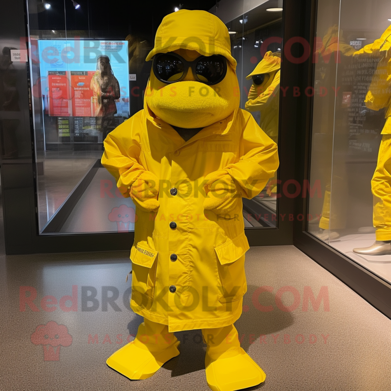 Yellow Marine Recon mascot costume character dressed with a Raincoat and Scarves Yellow Marine Recon mascot costume character dressed with a Raincoat and Scarves
