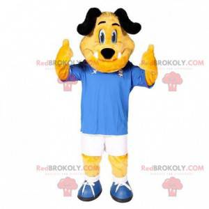 Mascote cachorro amarelo e preto em roupas esportivas -