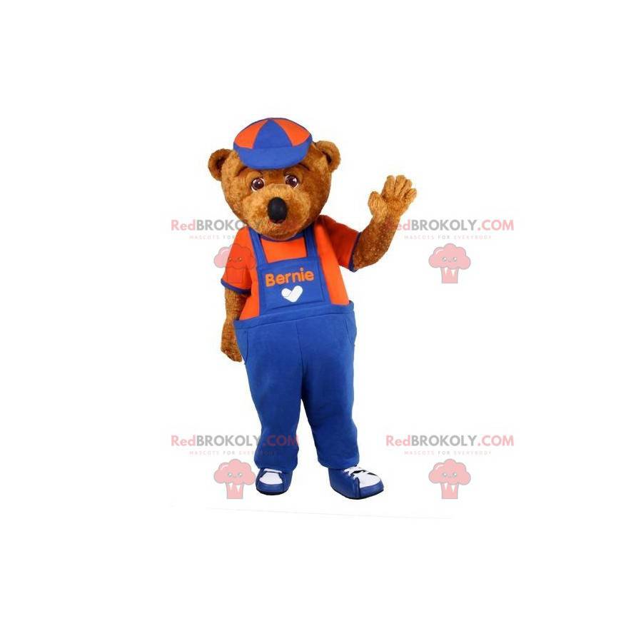Mascota del oso de peluche marrón vestida con un mono -