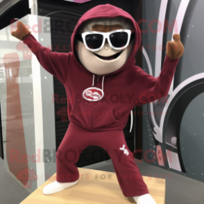 Maroon Trapeze Artist mascot costume character dressed with a Hoodie and Sunglasses