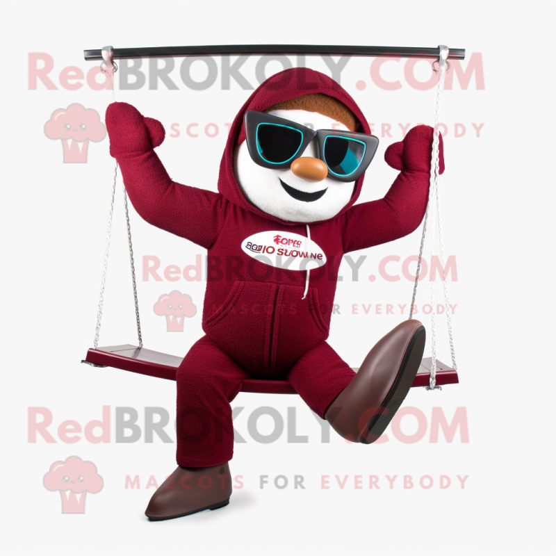 Maroon Trapeze Artist mascot costume character dressed with a Hoodie and Sunglasses Maroon Trapeze Artist mascot costume character dressed with a Hoodie and Sunglasses