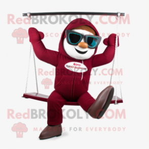 Maroon Trapeze Artist mascot costume character dressed with a Hoodie and Sunglasses