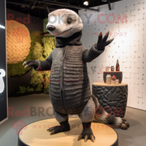 Black Pangolin mascot costume character dressed with a Cardigan and Beanies