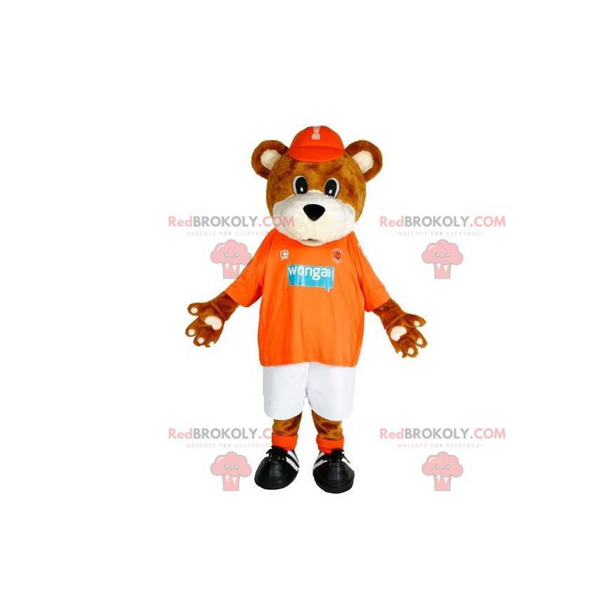Mascote urso marrom e branco em roupas esportivas -