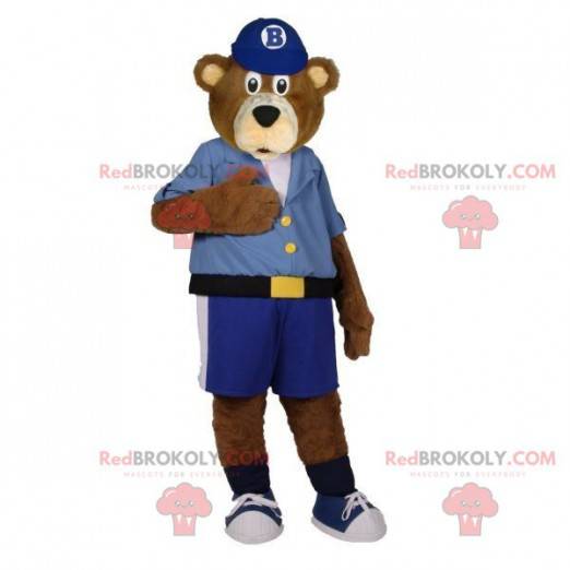 Mascote do urso pardo vestido com uma camisa e shorts -