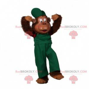 Mascota de mono peludo vestida con un traje verde -