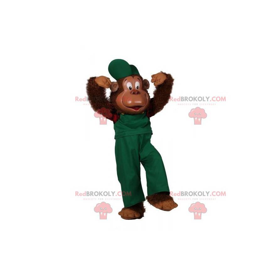 Mascote do macaco peludo vestido com uma roupa verde -