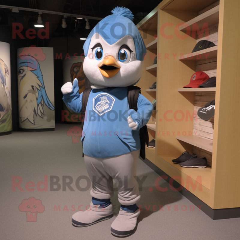 Gray Blue Jay mascot costume character dressed with a Hoodie and Backpacks