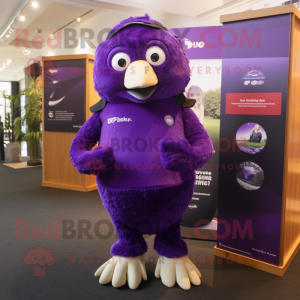 Purple Kiwi mascot costume character dressed with a Polo Tee and Gloves