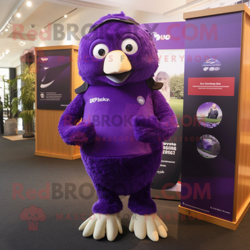 Purple Kiwi mascot costume character dressed with a Polo Tee and Gloves Purple Kiwi mascot costume character dressed with a Polo Tee and Gloves