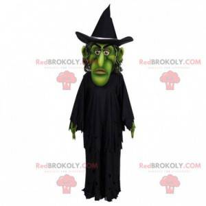 Green witch mascot dressed in black - Redbrokoly.com