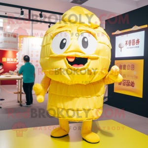 Yellow Dim Sum mascot costume character dressed with a Shorts and Earrings