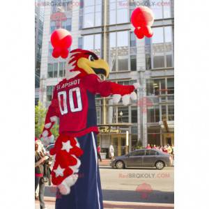 Mascotte d'aigle fier rouge et blanc en tenue bleue et rouge -