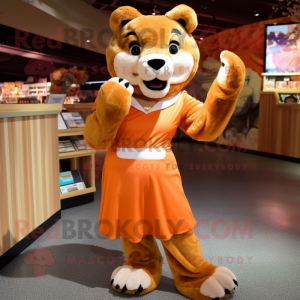 Orange Mountain Lion mascot costume character dressed with a Pleated Skirt and Mittens